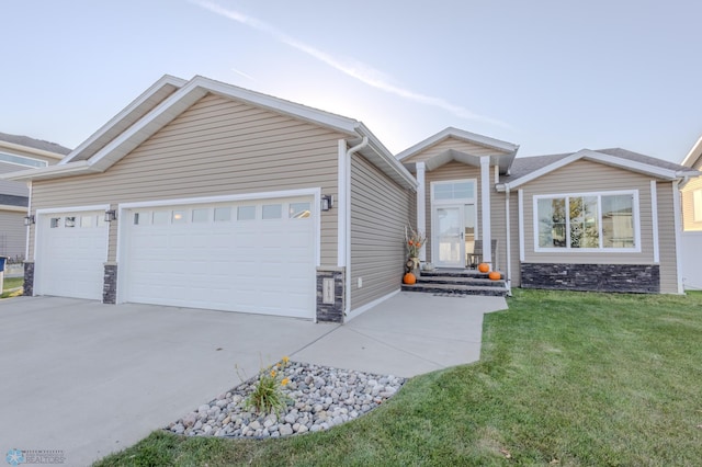 view of front of property with a front lawn and a garage