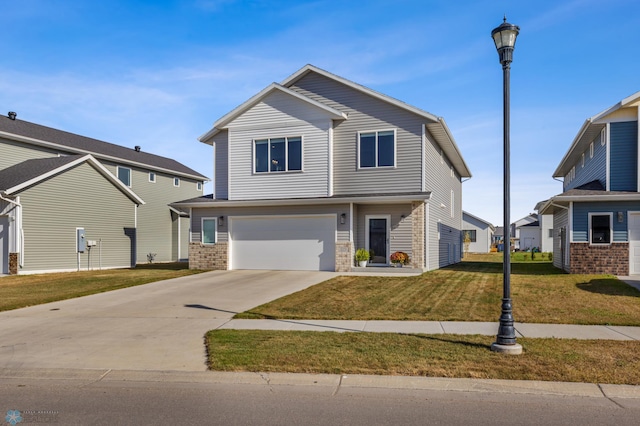 view of property featuring a front yard and a garage