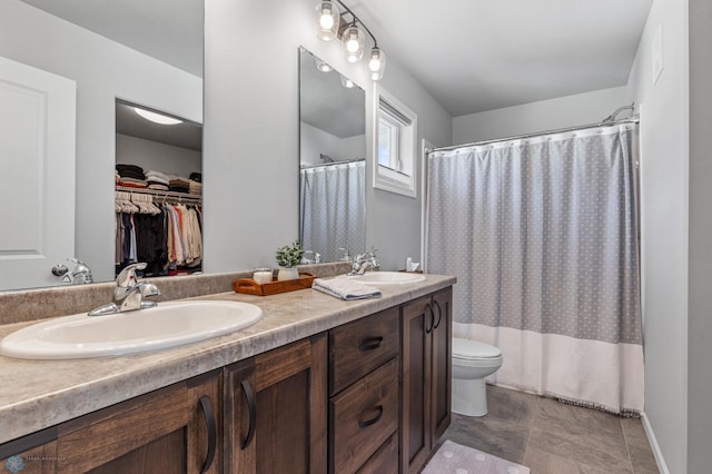 bathroom featuring vanity, a shower with shower curtain, and toilet