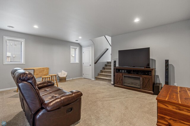 living room with light colored carpet and plenty of natural light