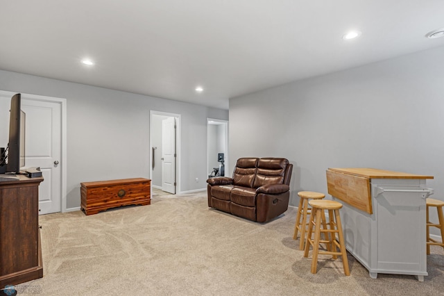 living room with light carpet and indoor bar