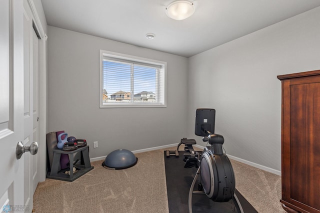 workout area featuring light colored carpet