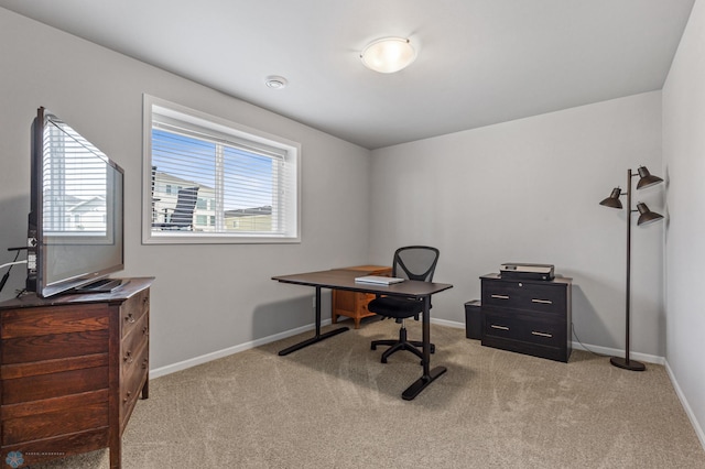 carpeted home office featuring a healthy amount of sunlight