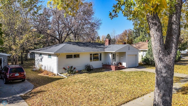 single story home with a front lawn and a garage