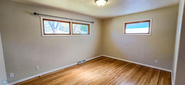 unfurnished room featuring light wood-type flooring