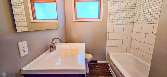 full bathroom featuring vanity, shower with separate bathtub, wood-type flooring, and toilet