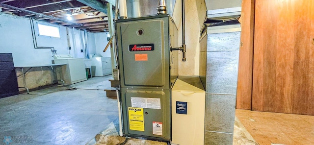 utility room with washing machine and dryer