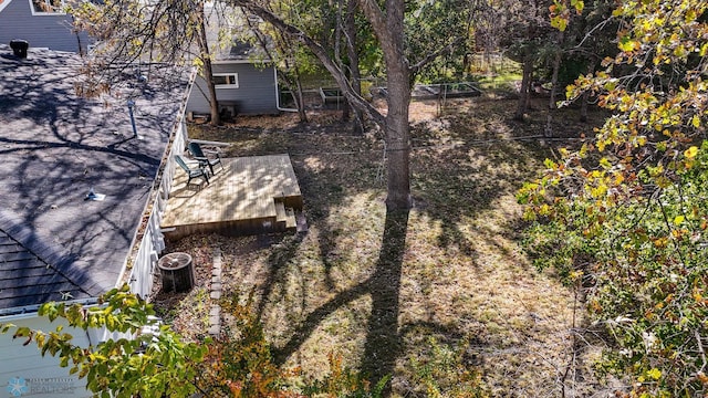 view of yard with a deck and cooling unit