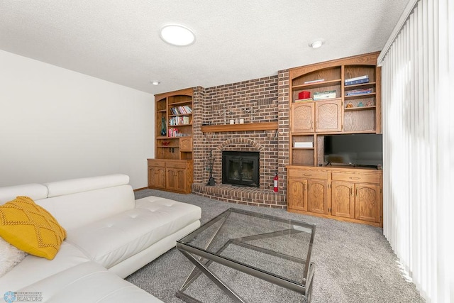 carpeted living room featuring a textured ceiling and a fireplace