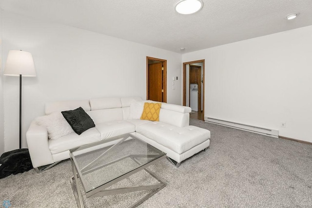 carpeted living room with a textured ceiling, washer / clothes dryer, and a baseboard radiator