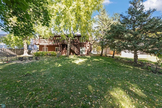 view of yard featuring a wooden deck