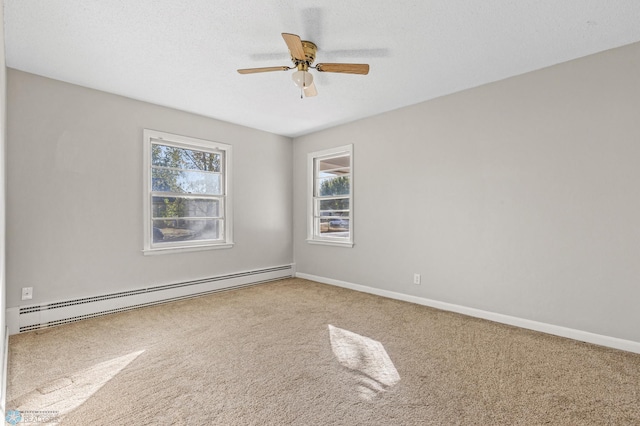 carpeted empty room with baseboard heating, a textured ceiling, and ceiling fan