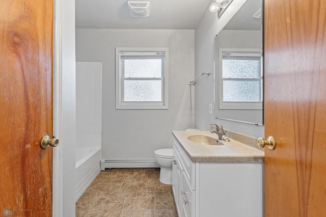 bathroom featuring toilet, baseboard heating, and vanity