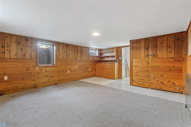 empty room featuring wood walls