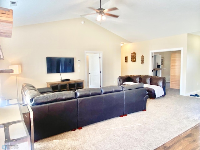 living room with lofted ceiling, hardwood / wood-style floors, and ceiling fan