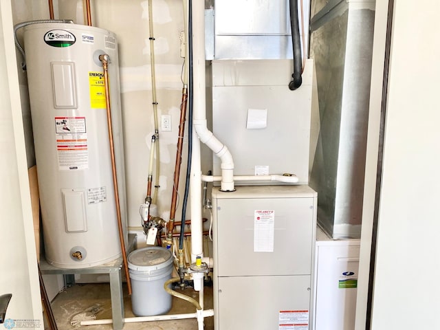 utility room featuring water heater