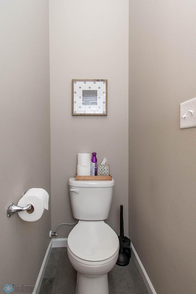 bathroom featuring toilet and hardwood / wood-style floors