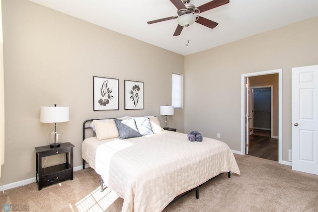 bedroom featuring light colored carpet and ceiling fan