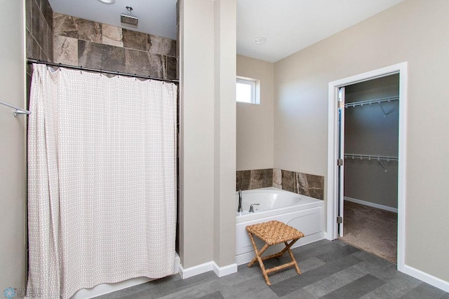 bathroom featuring separate shower and tub