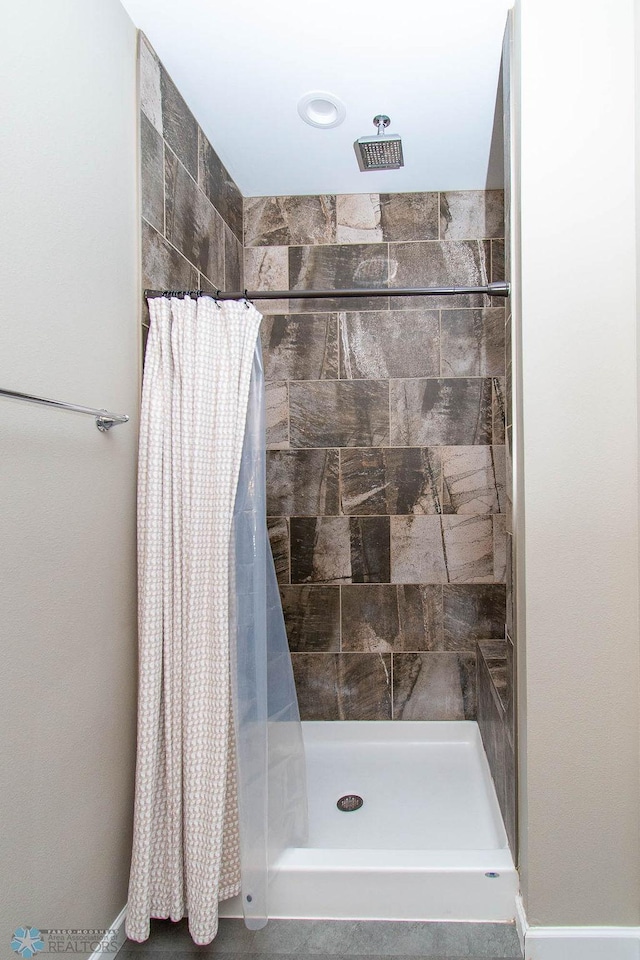 bathroom featuring walk in shower