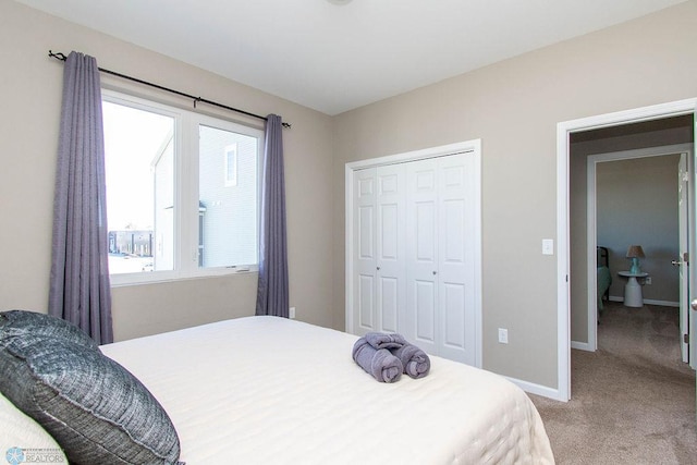 carpeted bedroom featuring a closet