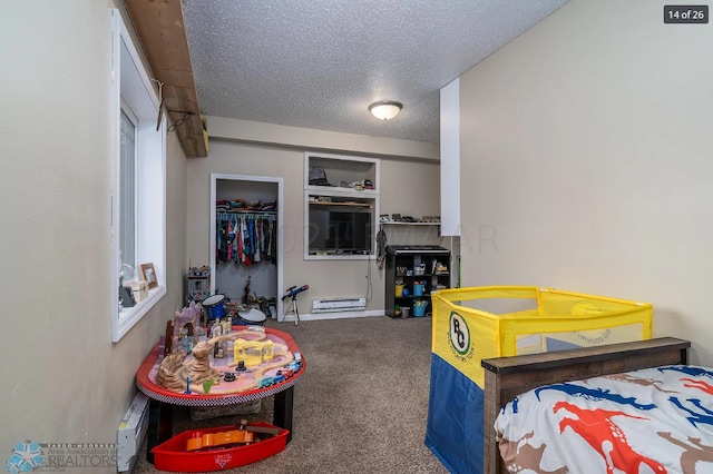 carpeted bedroom featuring a closet and a textured ceiling