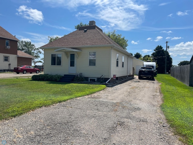 bungalow with a front lawn