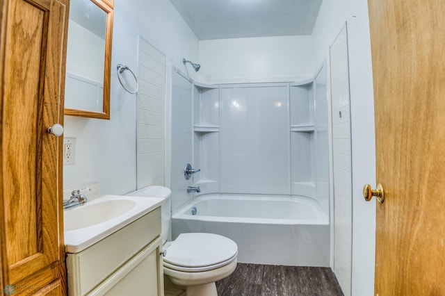 full bathroom featuring vanity, toilet,  shower combination, and wood-type flooring