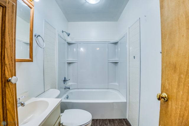 full bathroom featuring vanity, wood-type flooring, toilet, and shower / bath combination