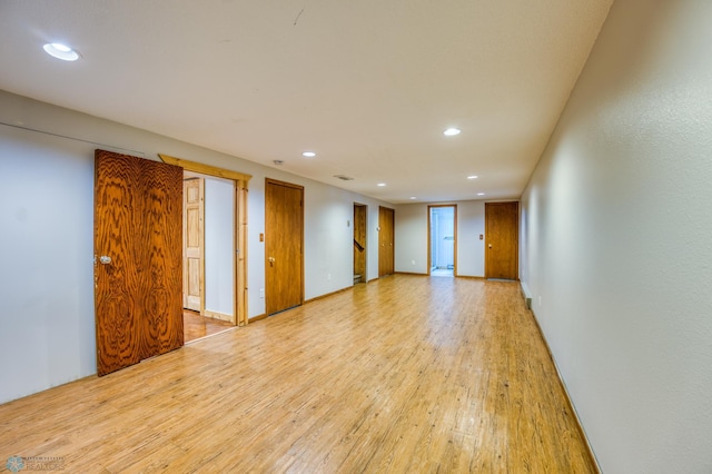 unfurnished room with light wood-type flooring