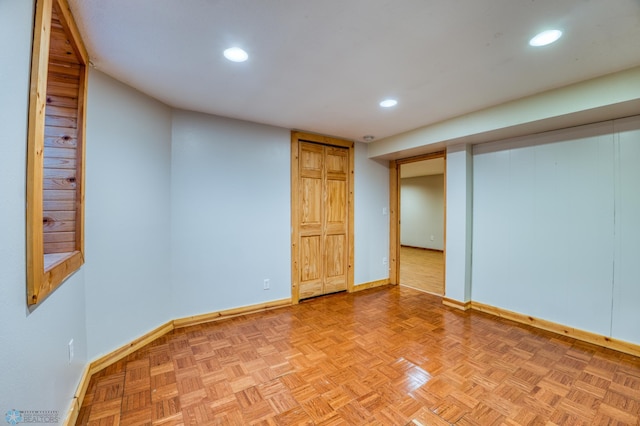 basement featuring light parquet floors