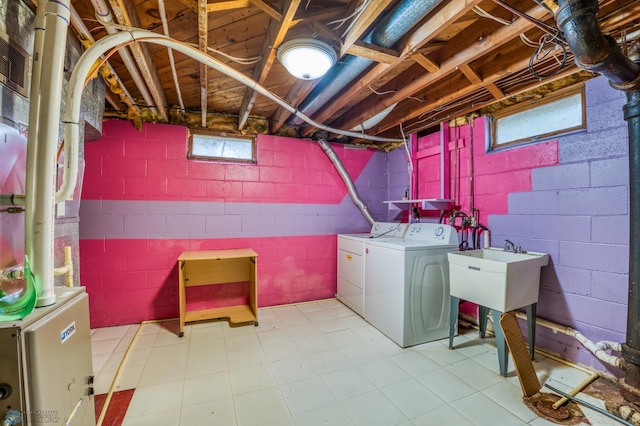 washroom featuring sink and washer and clothes dryer