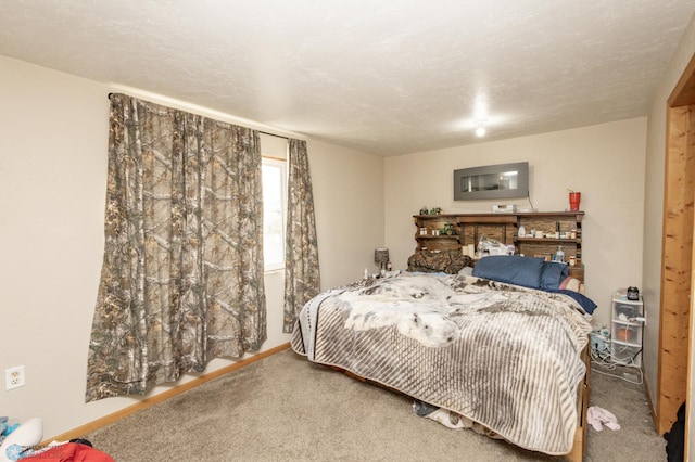 carpeted bedroom with a textured ceiling