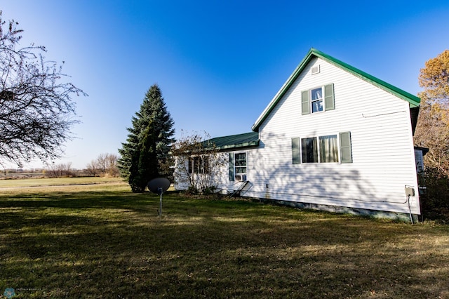 back of house with a yard