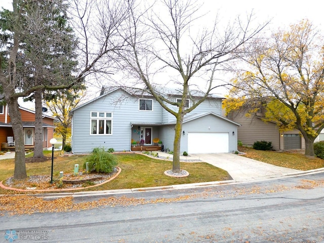 view of front of house featuring a front yard and a garage