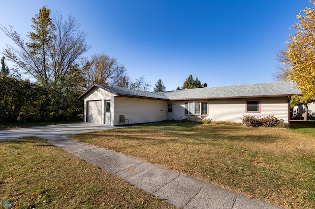 view of front facade with a front lawn and a garage