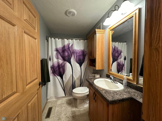 bathroom featuring a textured ceiling, a shower with shower curtain, toilet, vanity, and tile patterned flooring