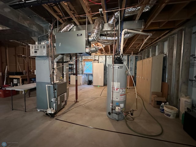 utility room featuring water heater and heating unit