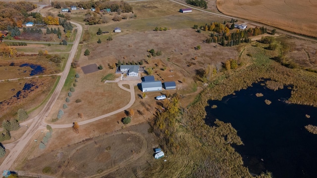 birds eye view of property with a rural view and a water view