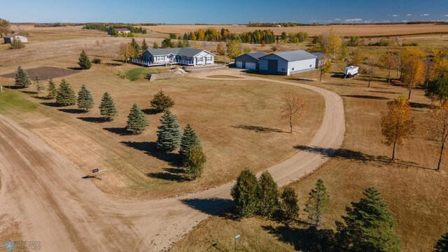 birds eye view of property featuring a rural view