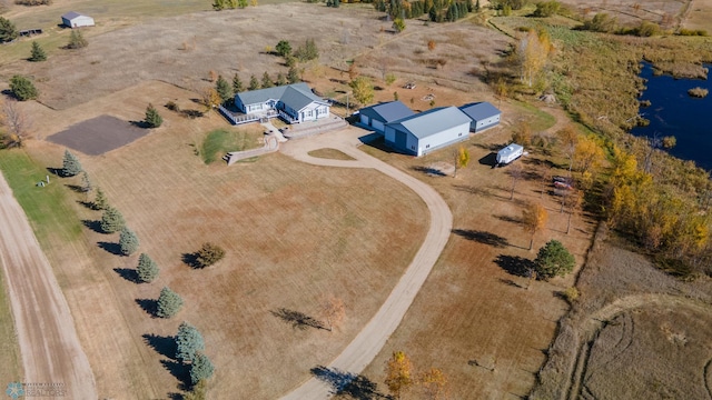 birds eye view of property with a rural view