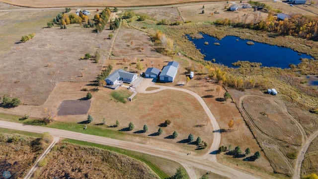 birds eye view of property featuring a rural view and a water view