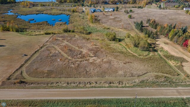 drone / aerial view with a water view and a rural view