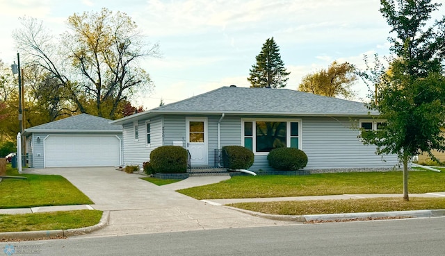 single story home with a front yard and a garage