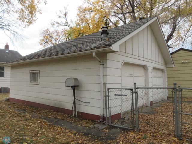 view of side of home with a garage