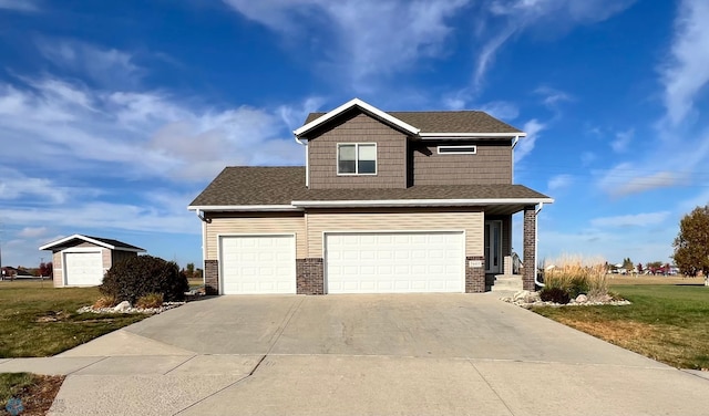 view of front of home featuring a garage and a front lawn