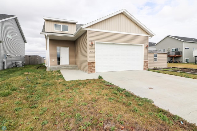 view of front of home with a front lawn and a garage