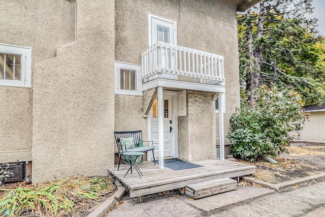 doorway to property featuring a balcony