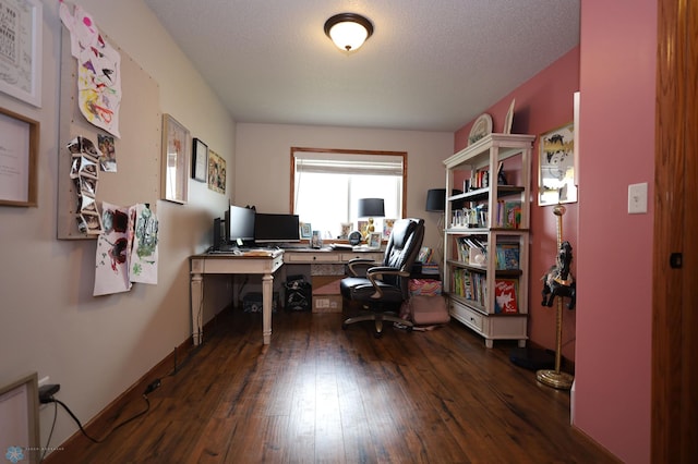 office space featuring dark wood-type flooring and a textured ceiling