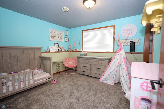 carpeted bedroom with a textured ceiling